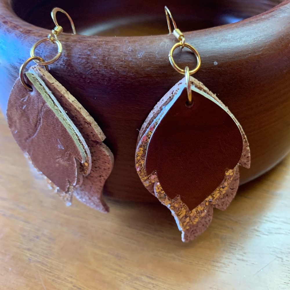 Brown leather, glitter, and cork earrings with gold filled ear wires.